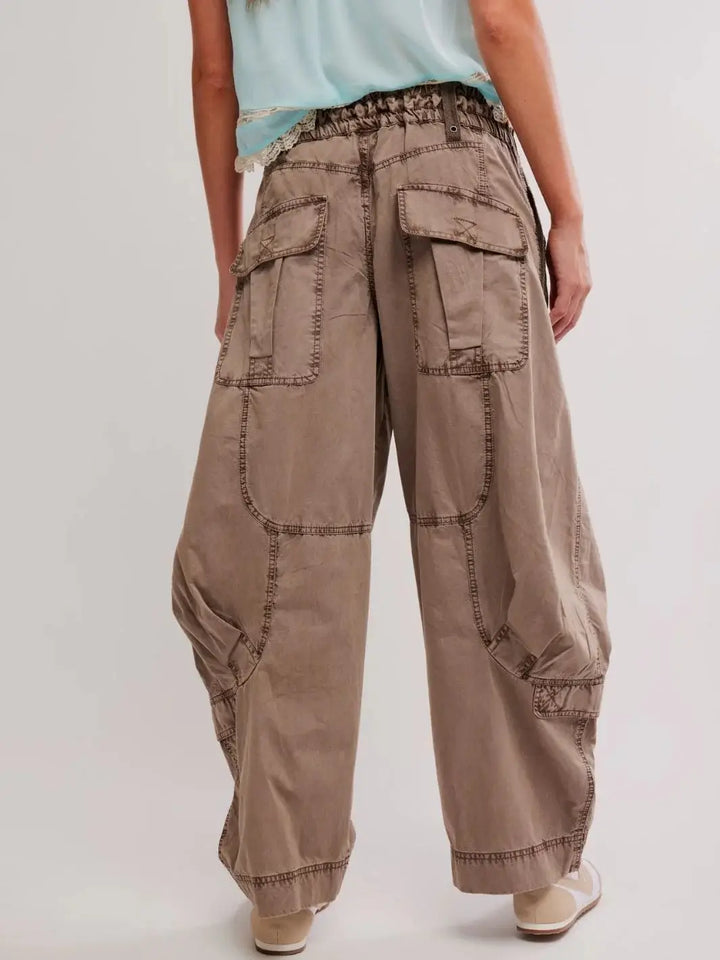 A close-up back view showcases the large flap pockets and slouchy, wide-leg fit of the Free People Onset Cargo Pants in Dusted Cocoa | Twentyseven Toronto