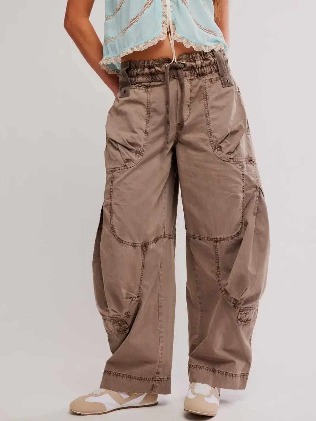 A straight front view highlights the slouchy drape, mid-rise fit, and casual silhouette of the Free People Onset Cargo Pants in Dusted Cocoa paired with sneakers | Twentyseven Toronto