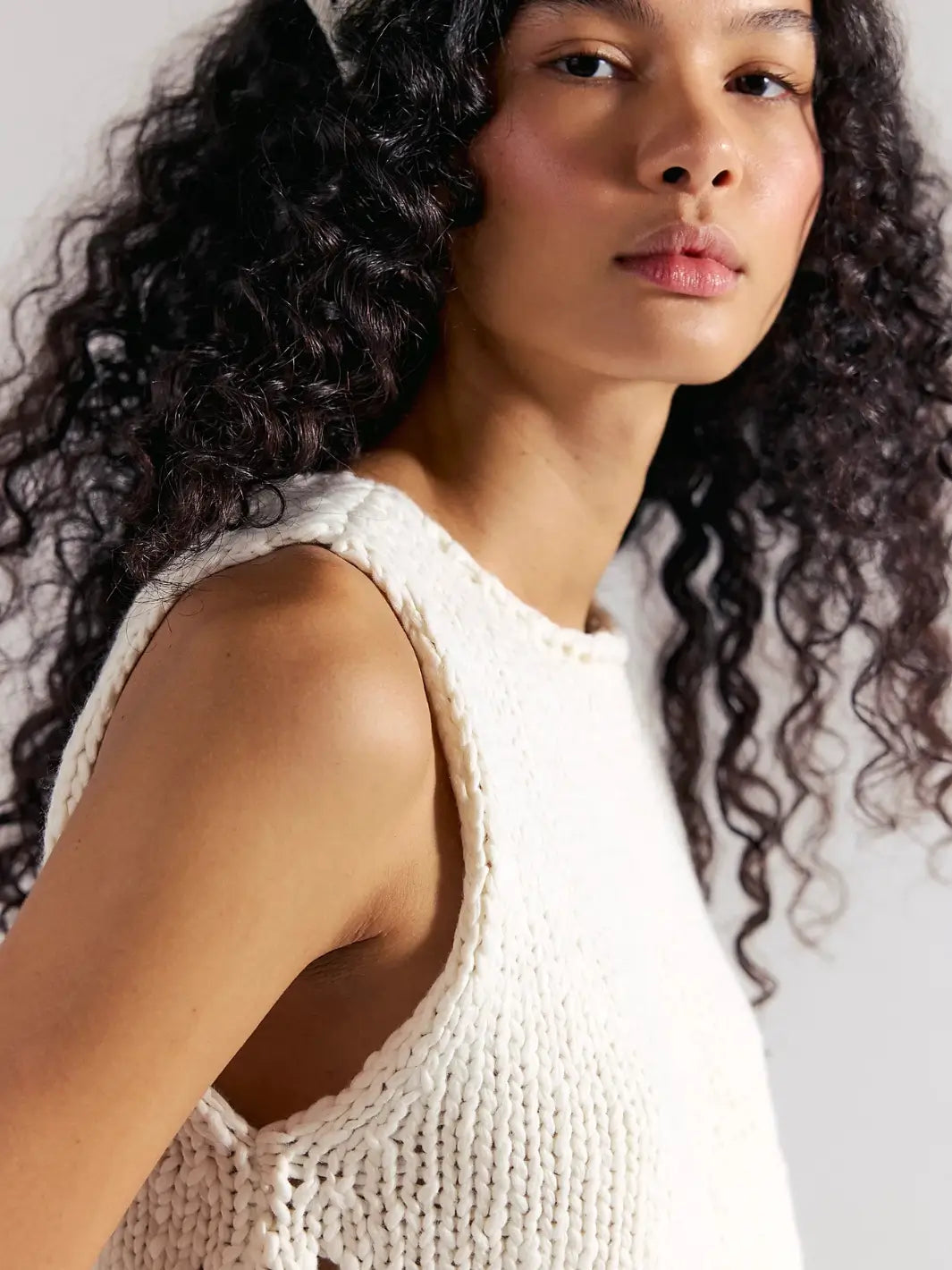 A close-up side view captures the thick, woven texture, rolled neckline, and comfortable armhole fit of the Free People Opal Knit Tank in Whisper White | Twentyseven Toronto