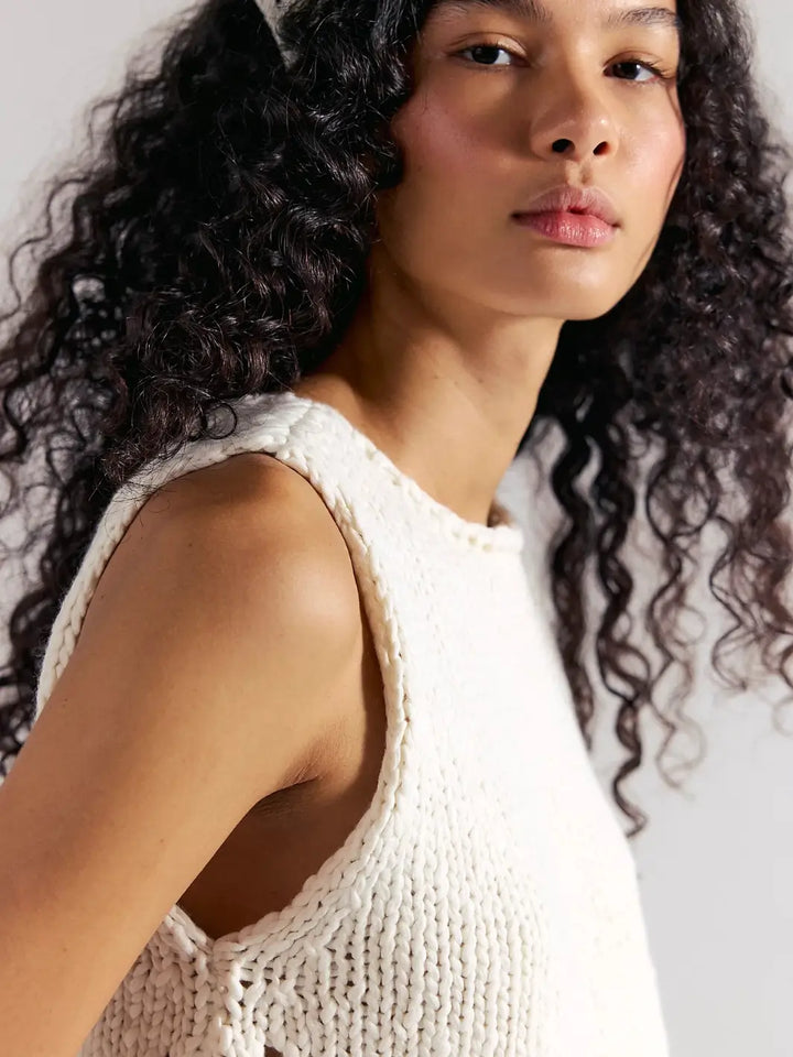 A close-up side view captures the thick, woven texture, rolled neckline, and comfortable armhole fit of the Free People Opal Knit Tank in Whisper White | Twentyseven Toronto