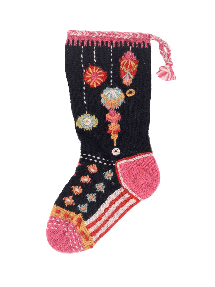 Lost Horizons Canada Ornaments Knit Christmas Stocking featuring colourful embroidered holiday ornaments on black wool, with a pink cuff, striped foot and braided hanging loop | Twentyseven Toronto