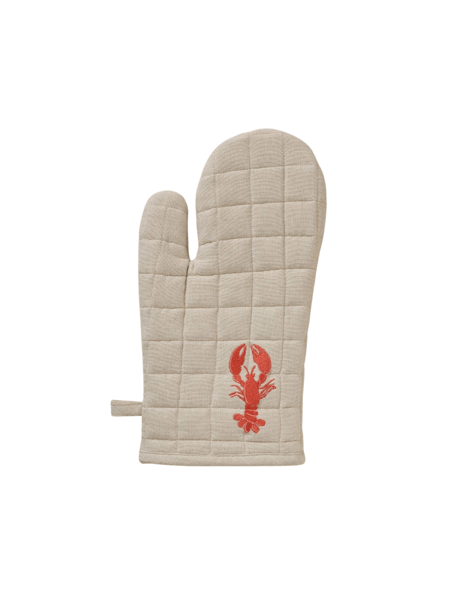 Beige oven mitt with red lobster design from Sylvie Thiriez on a transparent background | Twentyseven Toronto