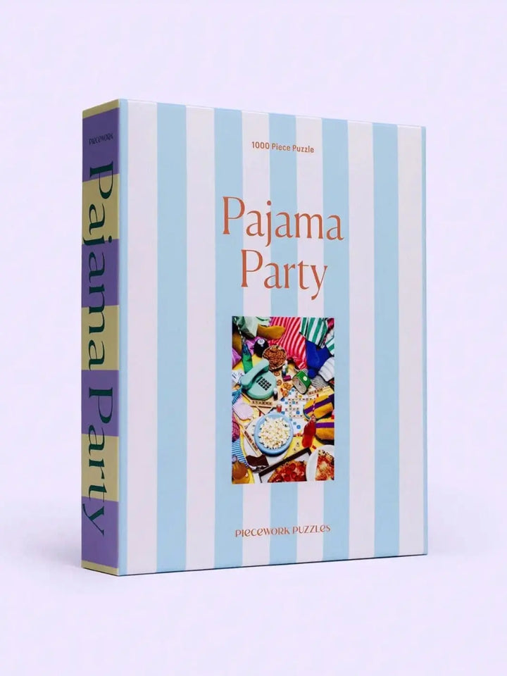 Piecework Puzzles 'Pajama Party' 1000 piece puzzle box with blue striped design on a white background | Twentyseven Toronto