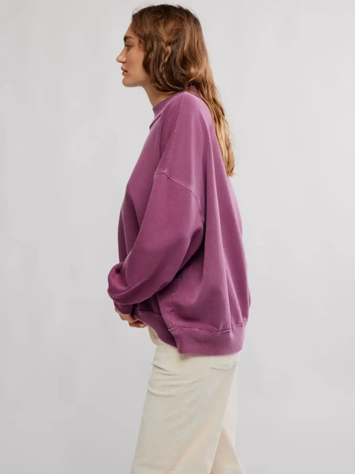 A side profile view displays the slouchy, dropped-shoulder silhouette and loose, comfortable drape of the Jungmaven Palm Springs Pullover in Damson | Twentyseven Toronto