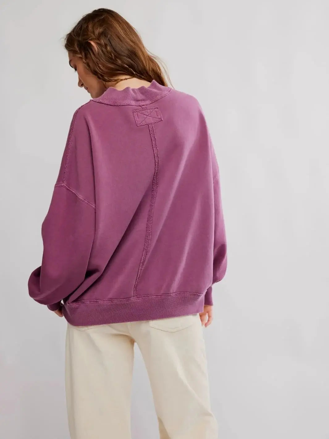A rear view reveals the distinct center-back seam and embroidered stitch detailing near the neckline of the Jungmaven Palm Springs Pullover in Damson | Twentyseven Toronto