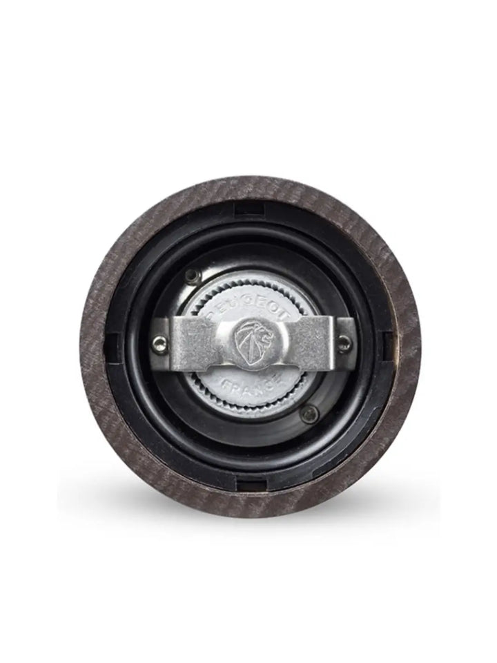 Close-up of a 'Paris U'Select Wood Pepper Mill Grinder' mechanical component with a central bearing from Peugeot on a white background | Twentyseven Toronto