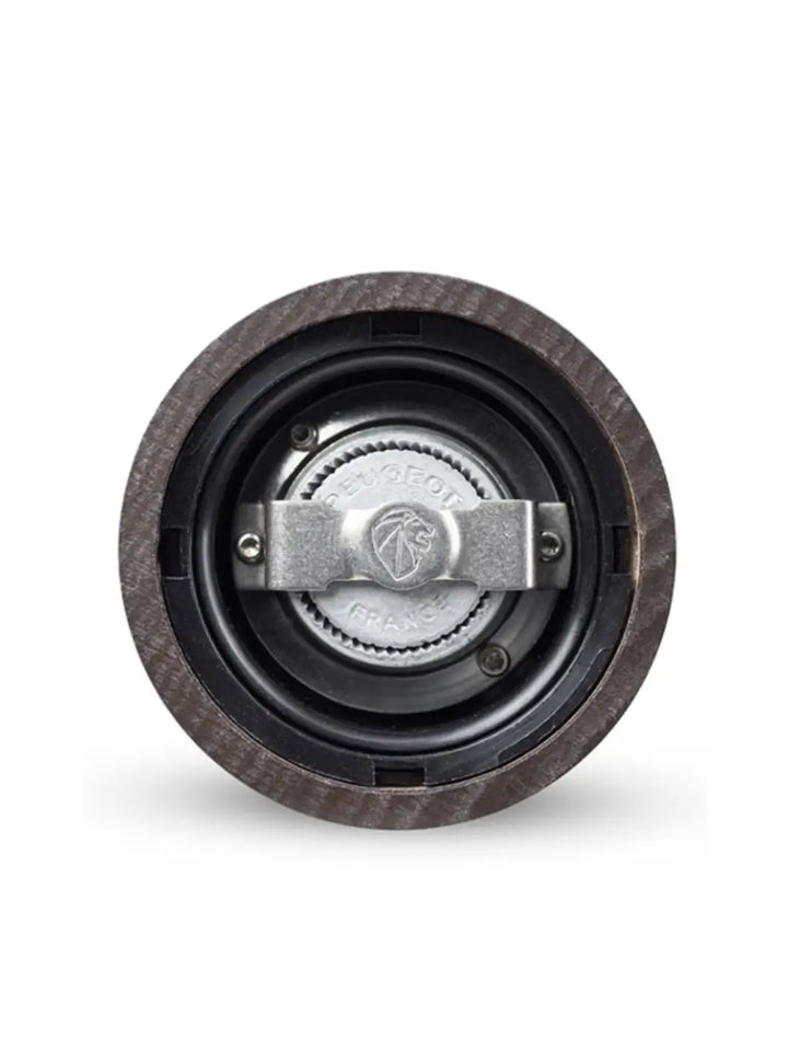 Close-up of a 'Paris U'Select Wood Pepper Mill Grinder' mechanical component with a central bearing from Peugeot on a white background | Twentyseven Toronto