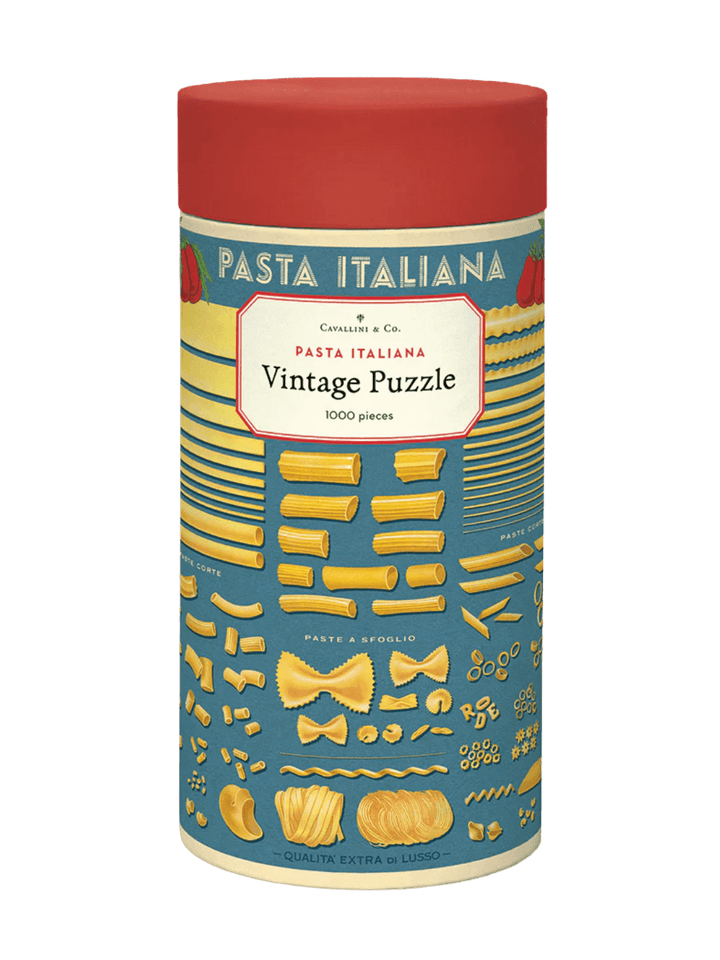 Cylindrical paper tube for the Cavallini Paper & Co Pasta 1000 Piece Puzzle with a red cap, highlighting a central title card surrounded by neatly arranged illustrations of golden pasta varieties | Twentyseven Toronto