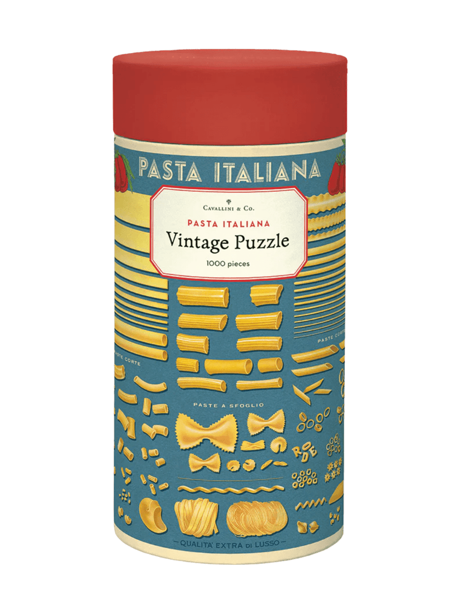 Cylindrical paper tube for the Cavallini Paper & Co Pasta 1000 Piece Puzzle with a red cap, highlighting a central title card surrounded by neatly arranged illustrations of golden pasta varieties | Twentyseven Toronto
