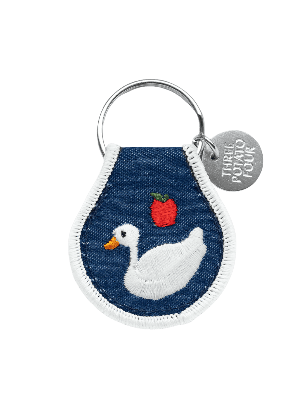 Keychain with goose and apple design on a blue background, featuring the brand 'Three Potato Four' | Twentyseven Toronto
