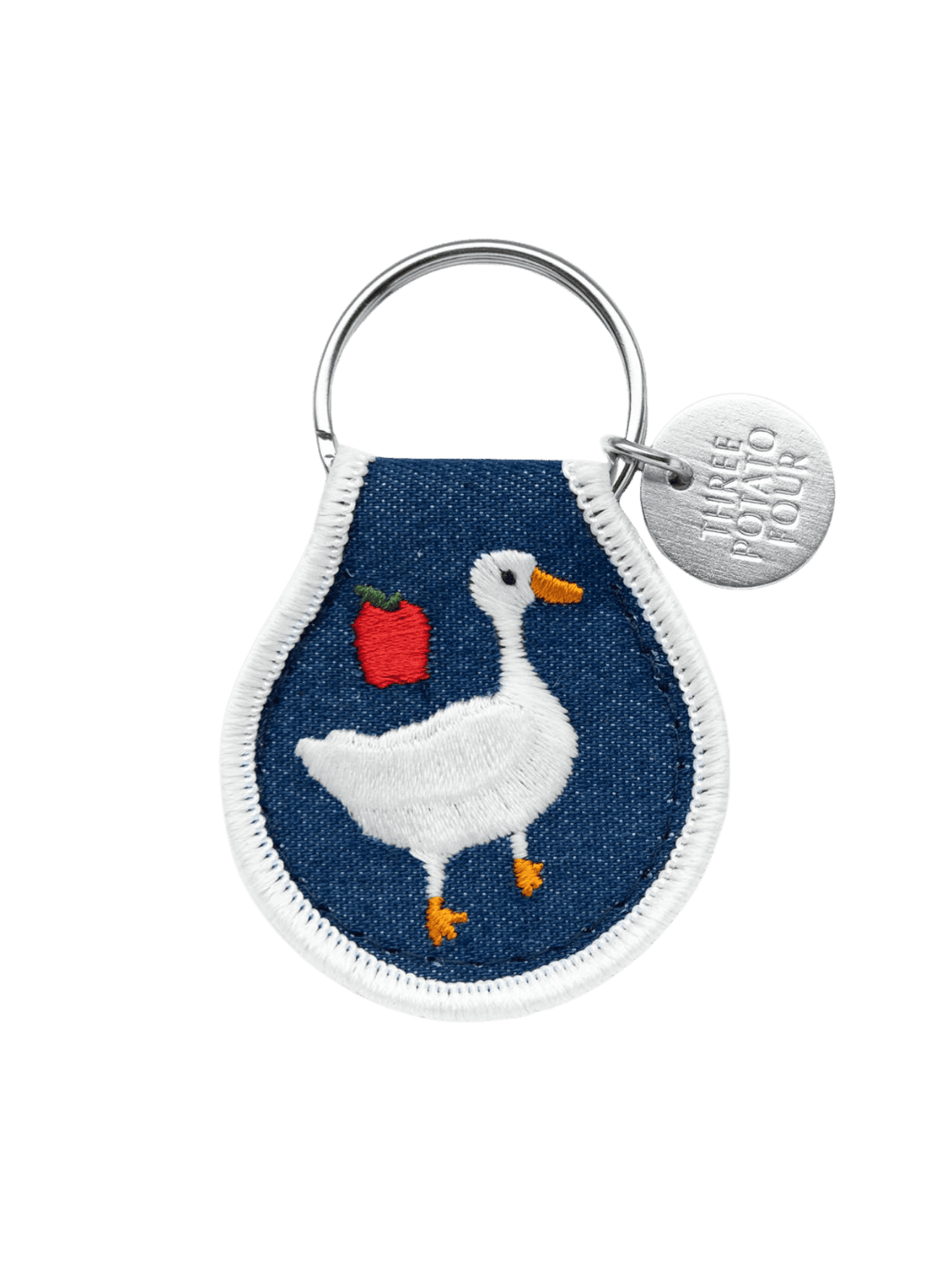 Keychain with goose and apple design on a blue background, featuring the brand 'Three Potato Four' | Twentyseven Toronto