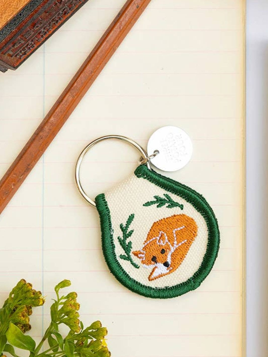 Patch keychain with embroidered fox design lifestyle image from Three Potato Four | Twentyseven Toronto