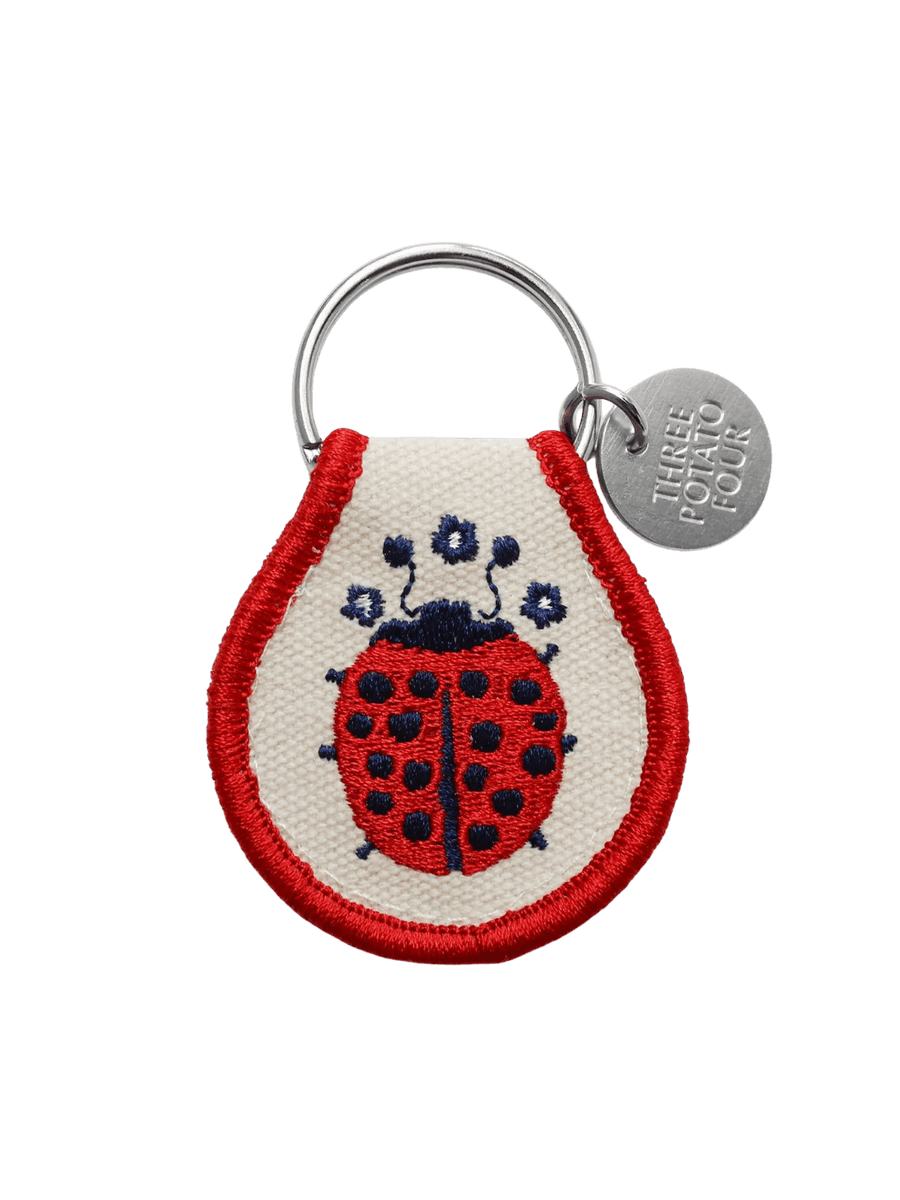 A Three Potato Four Patch Keychain - Ladybug with detailed red and blue embroidery | Twentyseven Toronto
