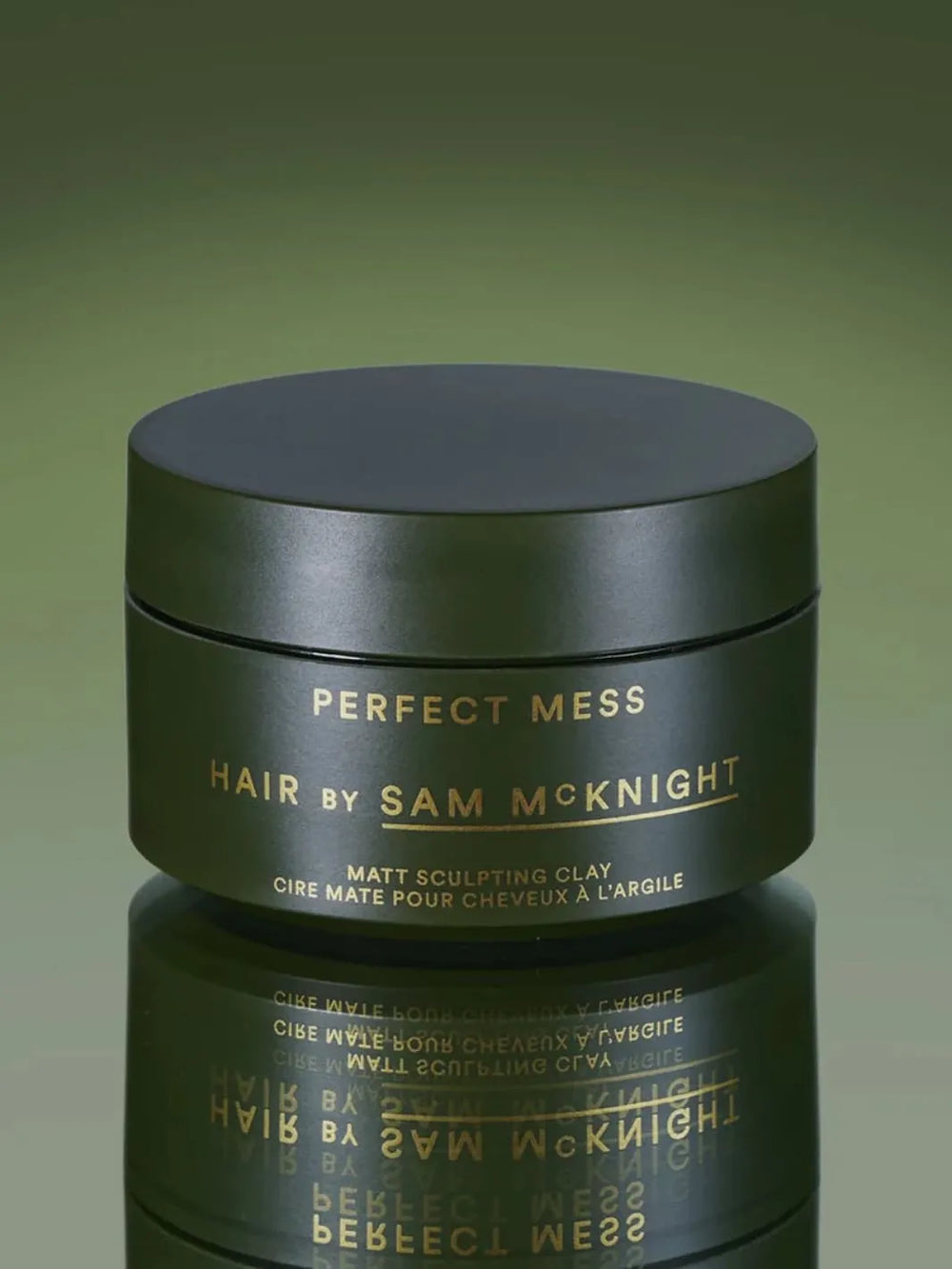 Jar of 'Perfect Mess' Soft Matt Styling Clay by Sam McKnight on a green background, 50ml | Twentyseven Toronto