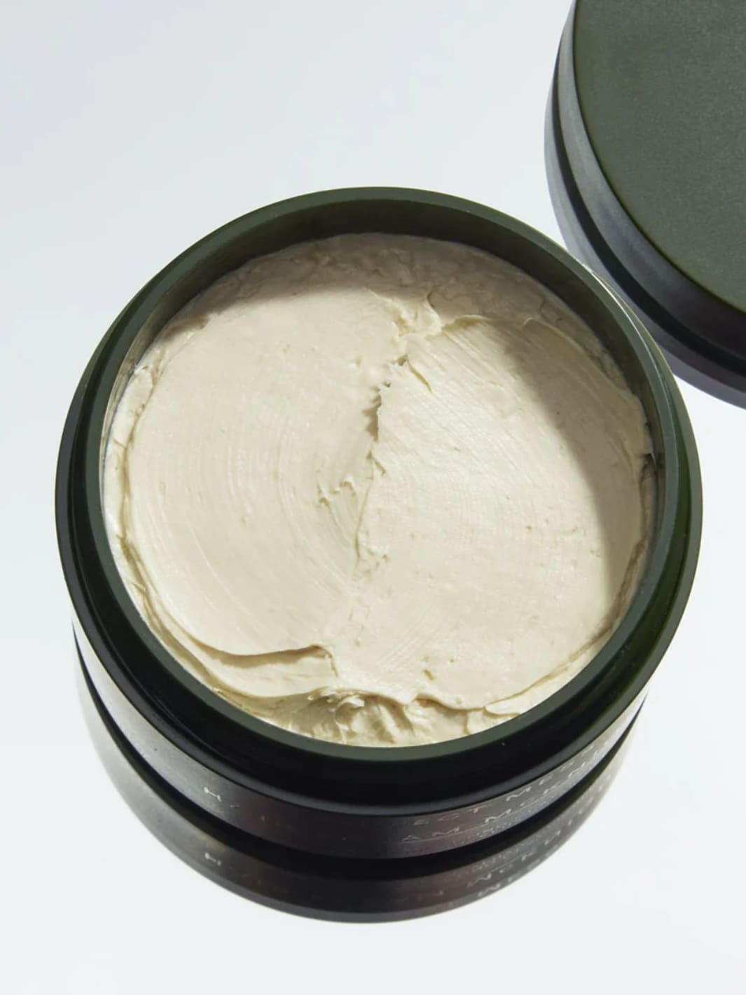 Open jar of 'Perfect Mess' Soft Matt Styling Clay by Sam McKnight with a light green/white cream inside, 50ml | Twentyseven Toronto