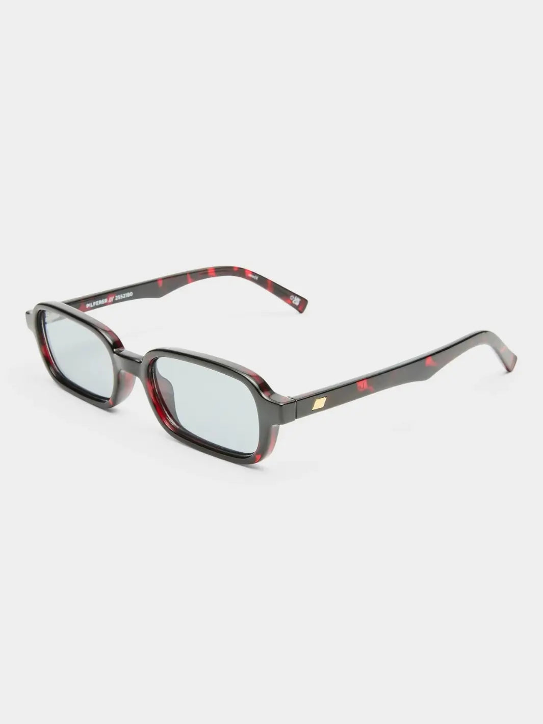 A three-quarter product shot of the dark red tortoiseshell Le Specs Pilferer - Cherry Tort glasses resting on a white studio background | Twentyseven Toronto