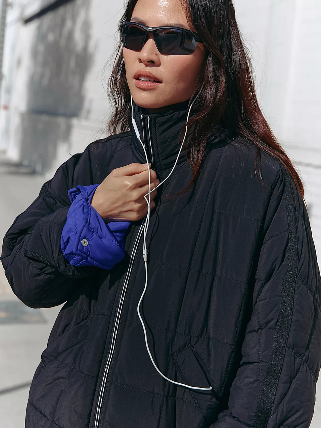 Model wearing the Pippa Packable Puffer Jacket in Black, featuring a quilted design, zip front and high collar | Twentyseven Toronto