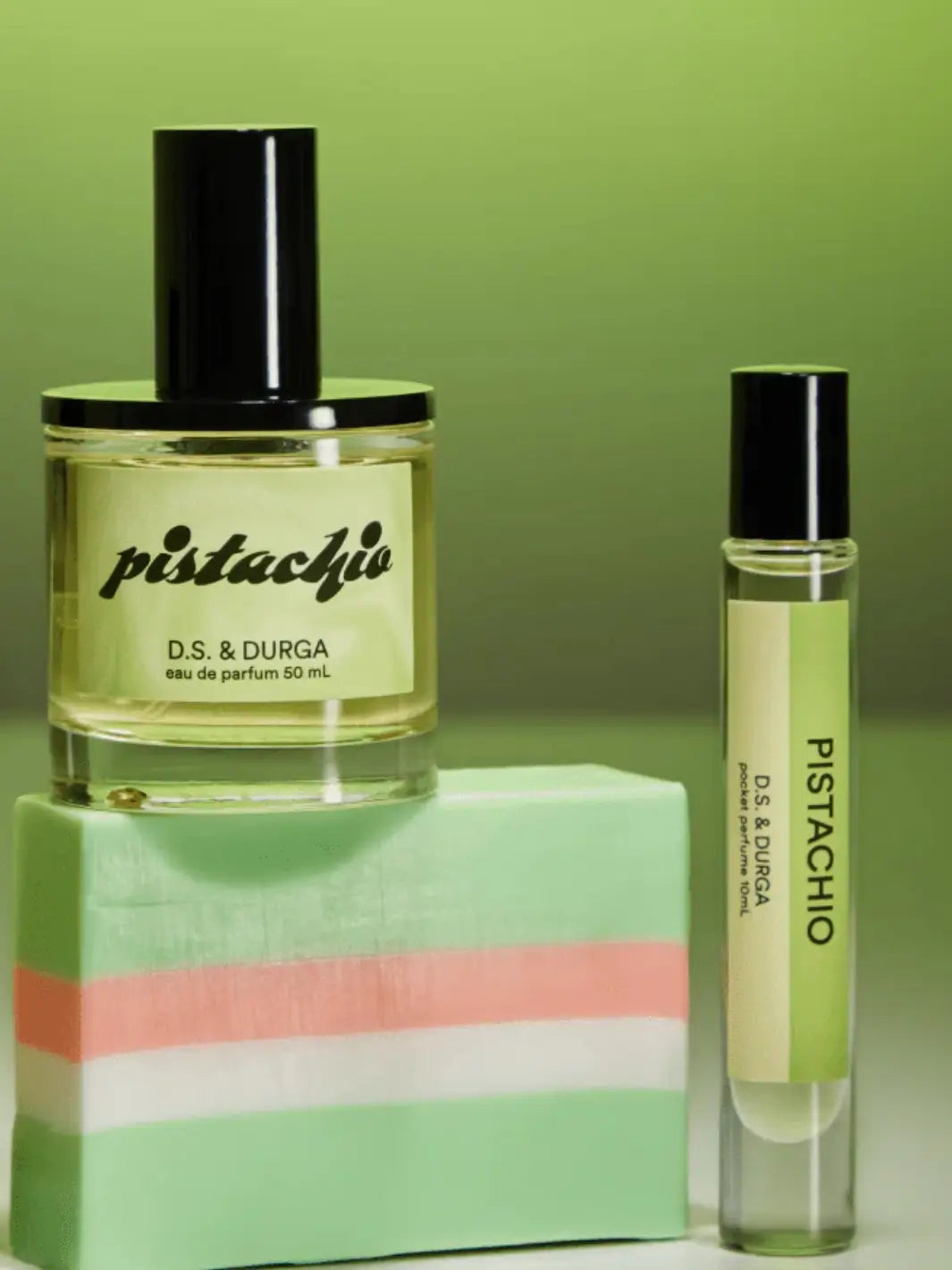 DS & Durga 'Pistachio' 50ml perfume and 10ml pocket perfume on a green background | Twentyseven Toronto
