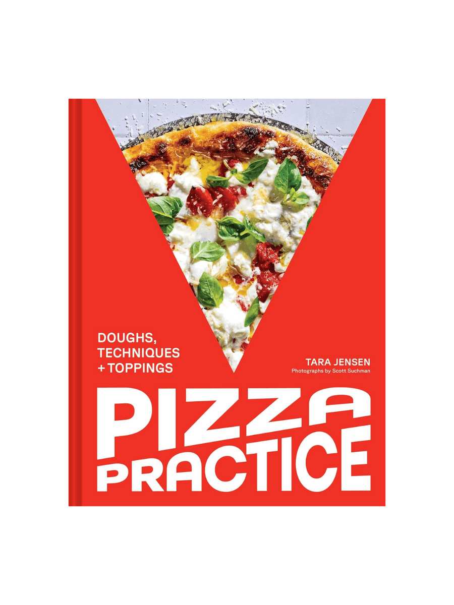 The book cover of Pizza Practice: Doughs, Techniques + Toppings by Tara Jensen, featuring rectangular pizza with a bubbly crust and fresh toppings on a floured wooden surface | Twentyseven Toronto