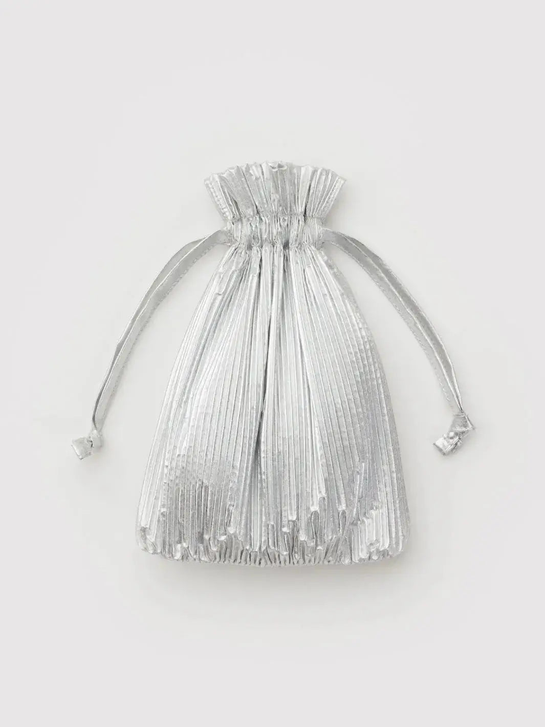 A small, metallic silver drawstring pouch with a pleated texture for the Baggu Pleated Baggu - Chrome Metallic | Twentyseven Toronto