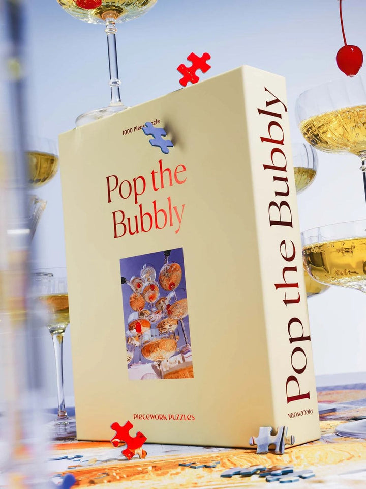 Piecework Puzzles Pop The Bubbly - 1000 Piece Puzzle | Twentyseven Toronto
