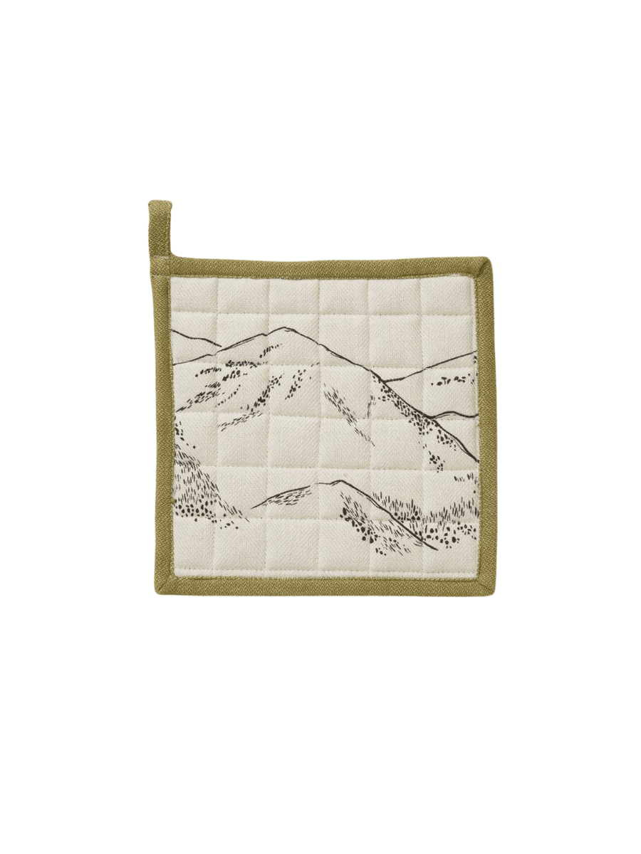 Quilted pot holder with mountain design  and green border from Sylvie Thiriez on a transparent background | Twentyseven Toronto