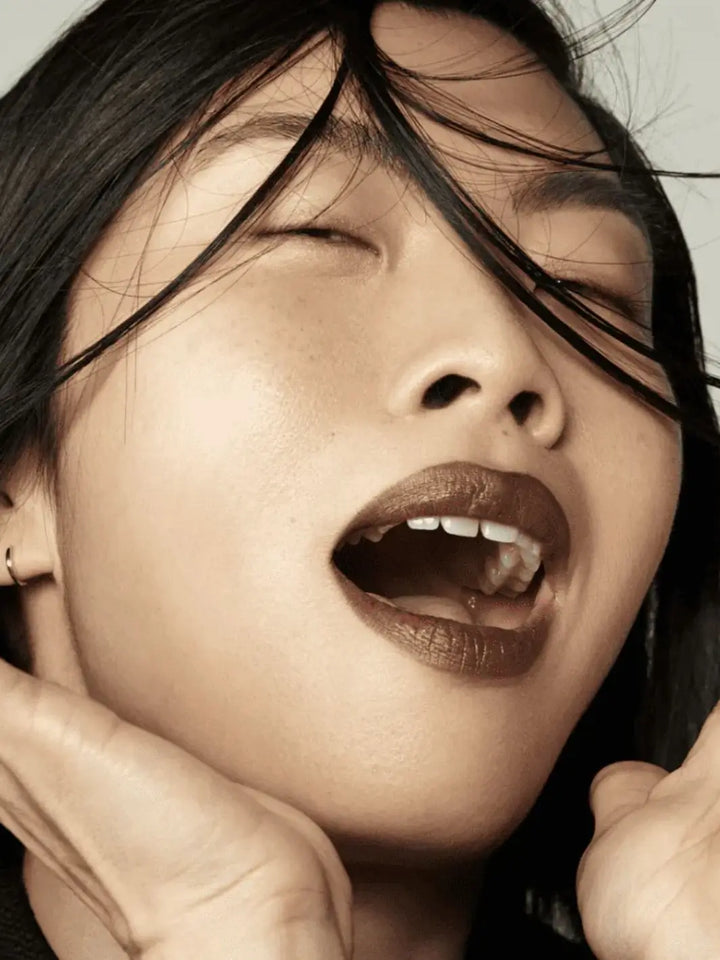 Close up shot of woman with dark hair wearing 19/99 Beauty Precision Colour Pencil in 'Barna' | Twentyseven Toronto