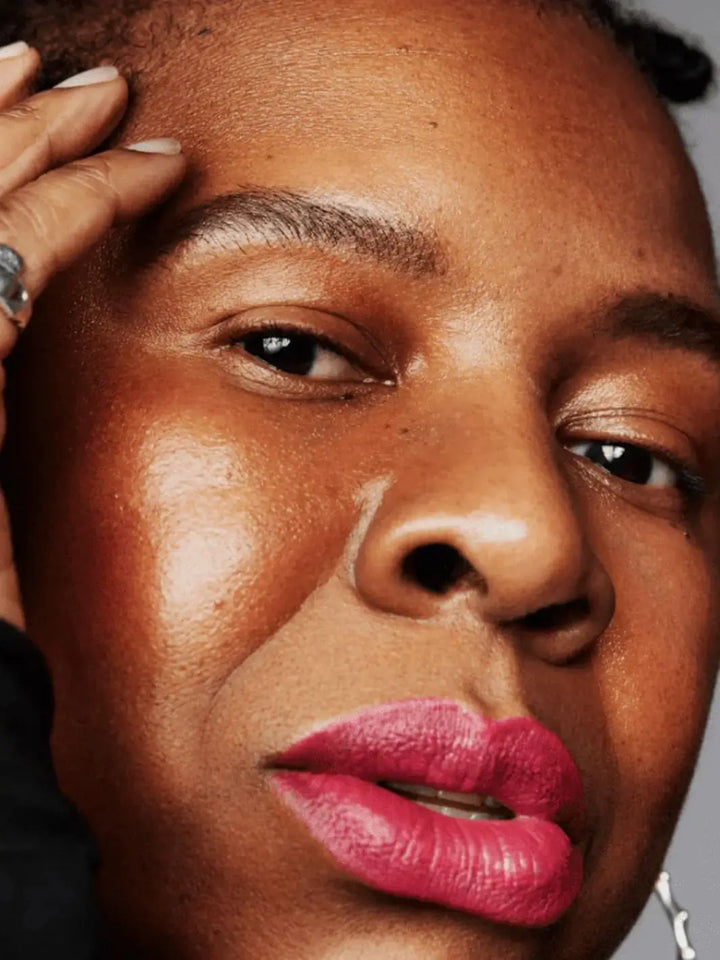 Close-up of a person with bright pink 'Rozsa' lip colour from 19/99 Beauty | Twentyseven Toronto