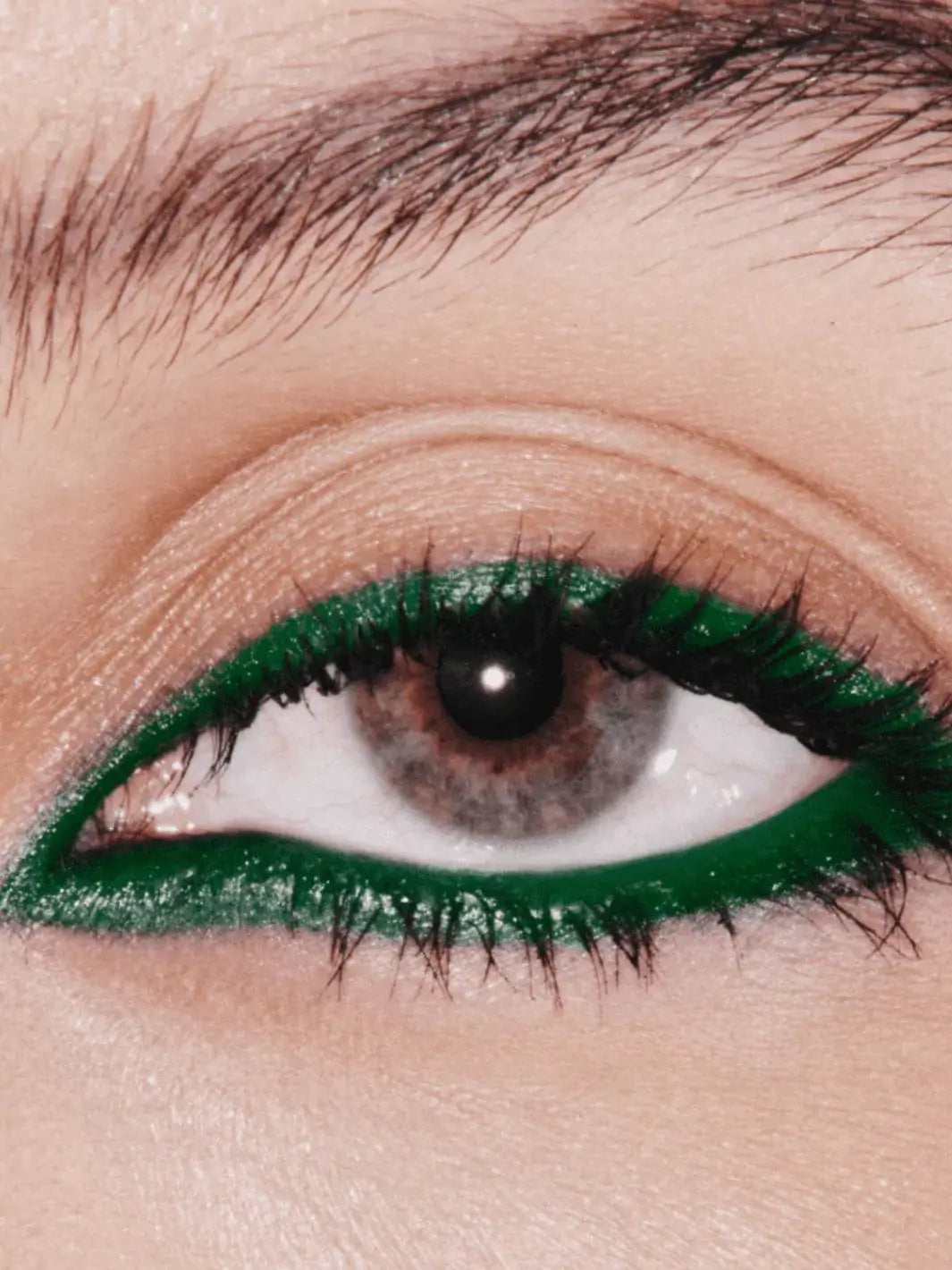 Close-up of an eye with 19/99 Precision Colour Pencil in 'Zold' green eyeliner | Twentyseven Toronto