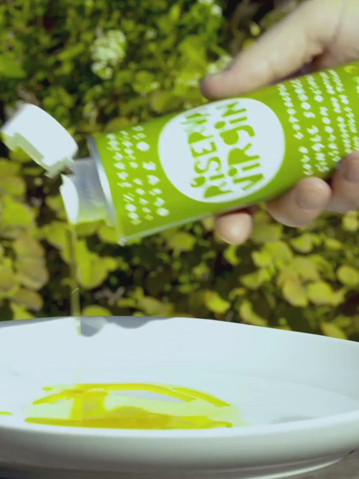 Video of person pouring Riserva Virgin Olive Oil from Casa Virgin onto a plate to show product texture | Twentyseven Toronto