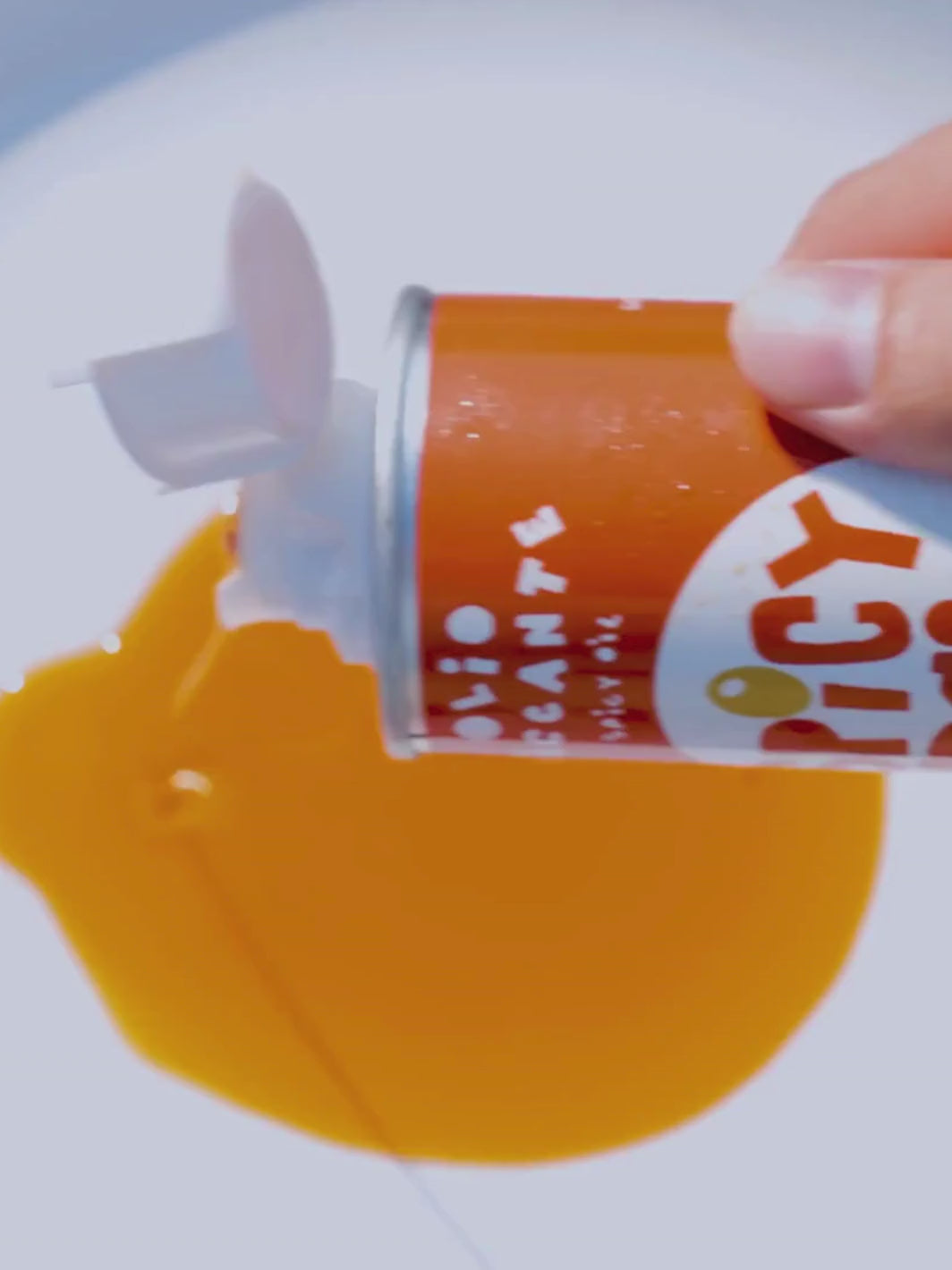 Video of person pouring Spicy Virgin Olive Oil from Casa Virgin onto a plate to show product texture | Twentyseven Toronto