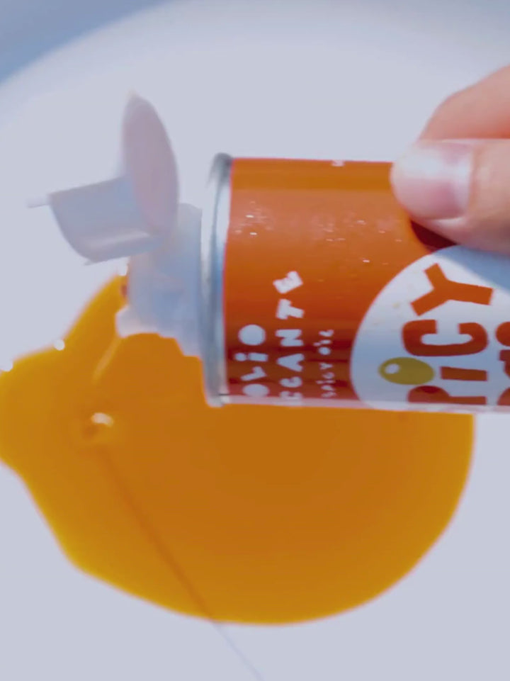 Video of person pouring Spicy Virgin Olive Oil from Casa Virgin onto a plate to show product texture | Twentyseven Toronto