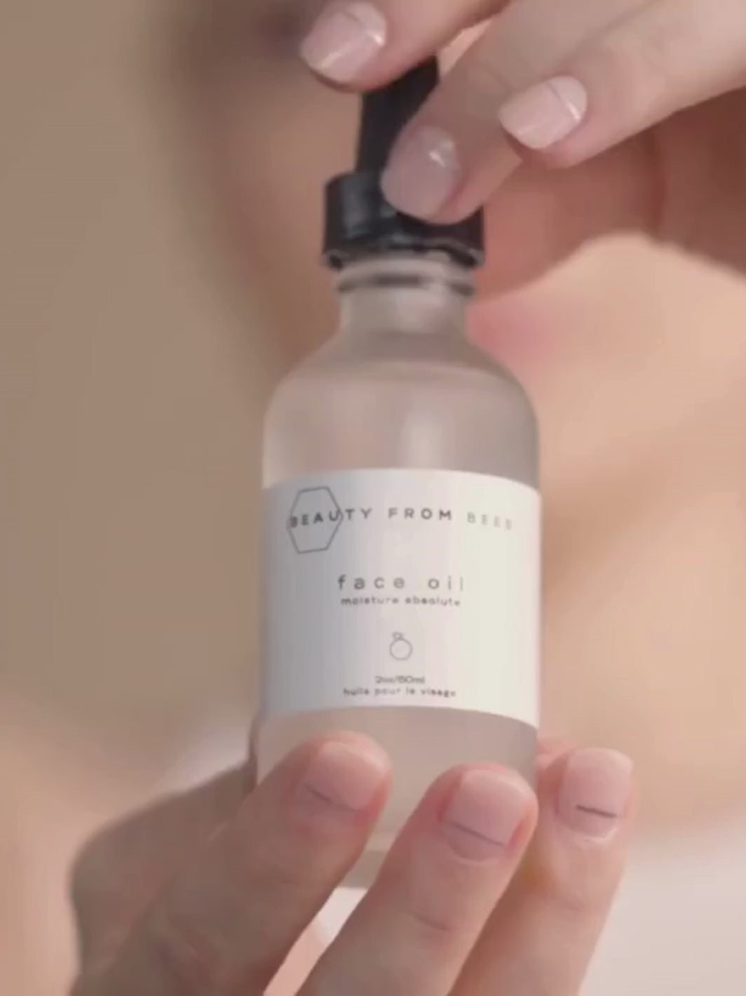 Video of woman showing how to use Beauty from Bees Face Oil (Moisture Absolute) | Twentyseven Toronto