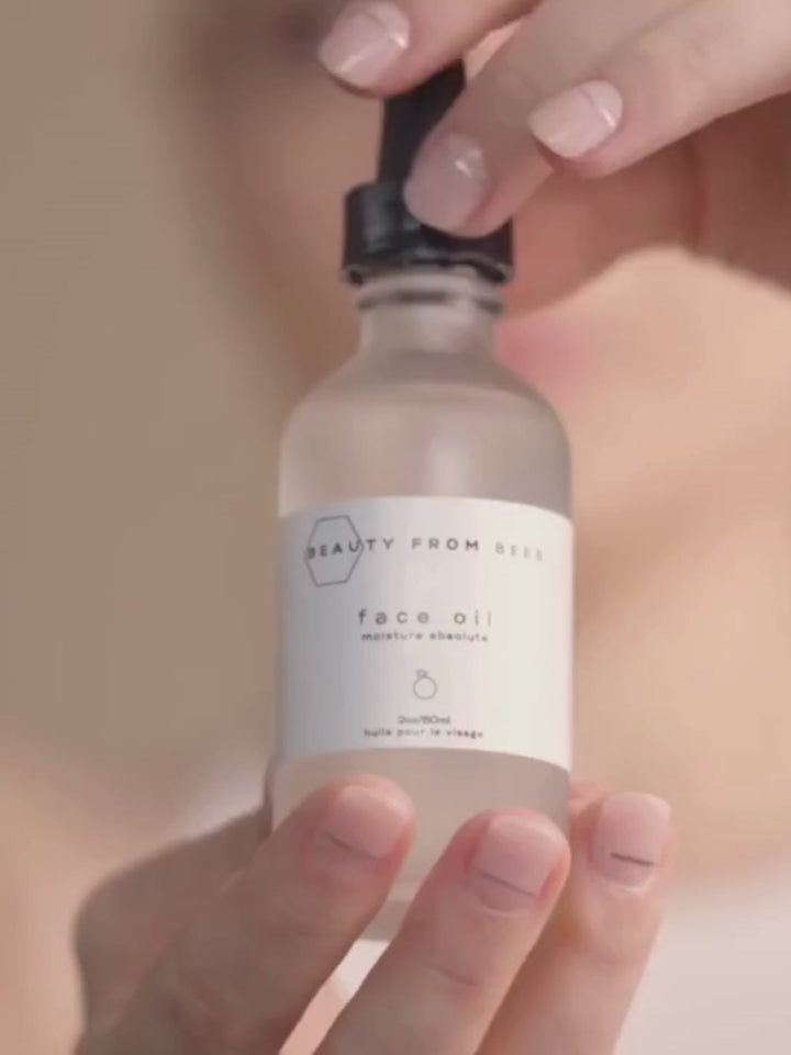 Video of woman showing how to use Beauty from Bees Face Oil (Moisture Absolute) | Twentyseven Toronto