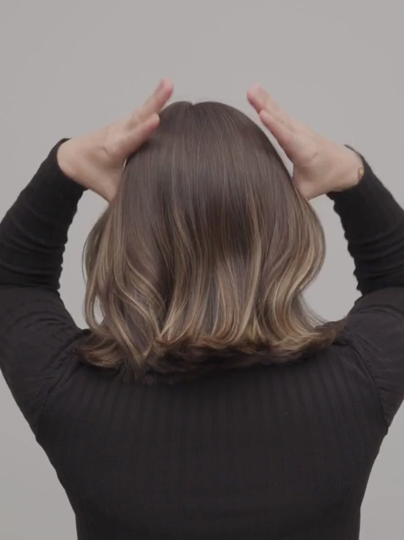 Woman putting her hair in an up-do with a MACHETE Hair Clip | Twentyseven Toronto