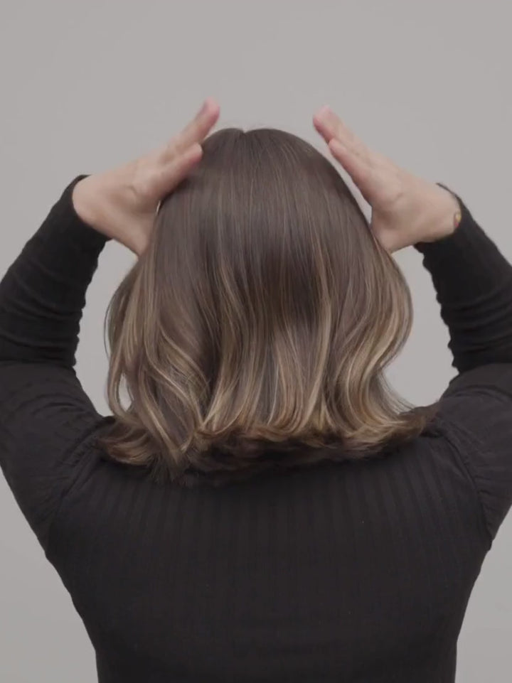 Woman putting her hair in an up-do with a MACHETE Hair Clip | Twentyseven Toronto