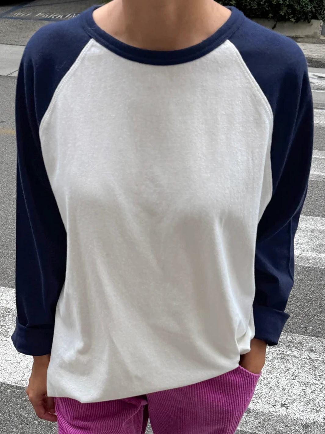 Front view of model wearing the Le Bon Shoppe Raglan Tee in white and midnight navy | Twentyseven Toronto