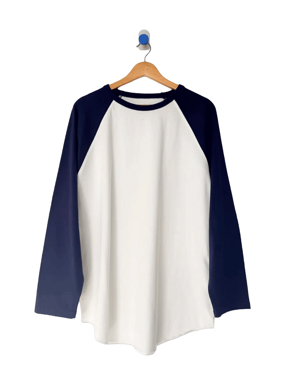 Le Bon Shoppe Raglan Tee in white with midnight navy sleeves on a wooden hanger | Twentyseven Toronto