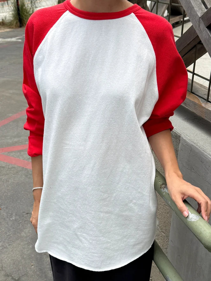 Front view of model wearing the Le Bon Shoppe Raglan Tee in white and tomato red | Twentyseven Toronto