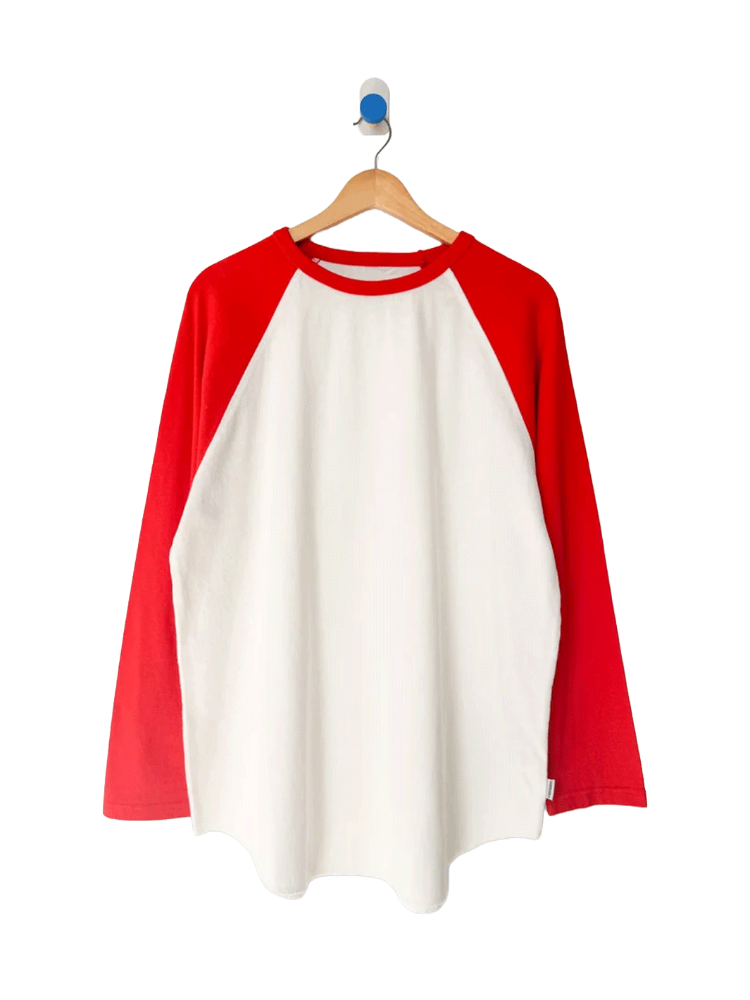 Le Bon Shoppe Raglan Tee in white with tomato red sleeves on a wooden hanger | Twentyseven Toronto