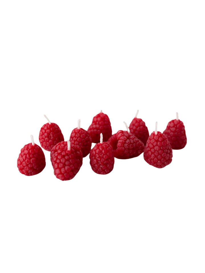 Red raspberry-shaped beeswax candles from Happy Organics on a transparent background | Twentyseven Toronto