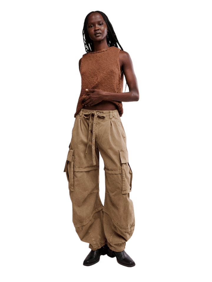 Full-length view of a model wearing Free People We the Free Reef Curved Twill Cargo Pants in Aloe paired with a brown knit sleeveless top | Twentyseven