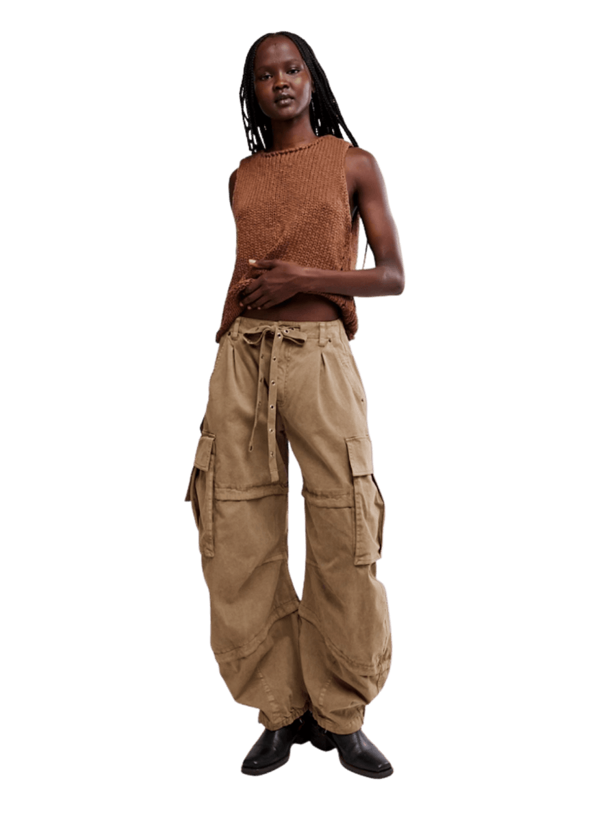 Full-length view of a model wearing Free People We the Free Reef Curved Twill Cargo Pants in Aloe paired with a brown knit sleeveless top | Twentyseven