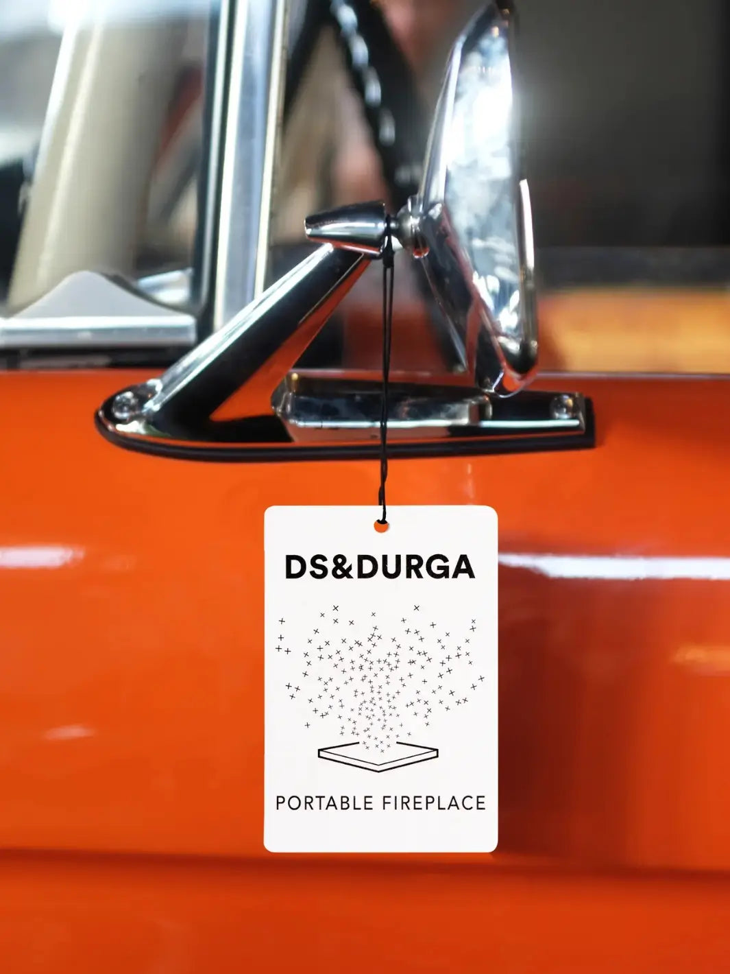 DS&Durga car fragrance in 'Portable Fireplace' on a car's chrome mirror | Twentyseven Toronto