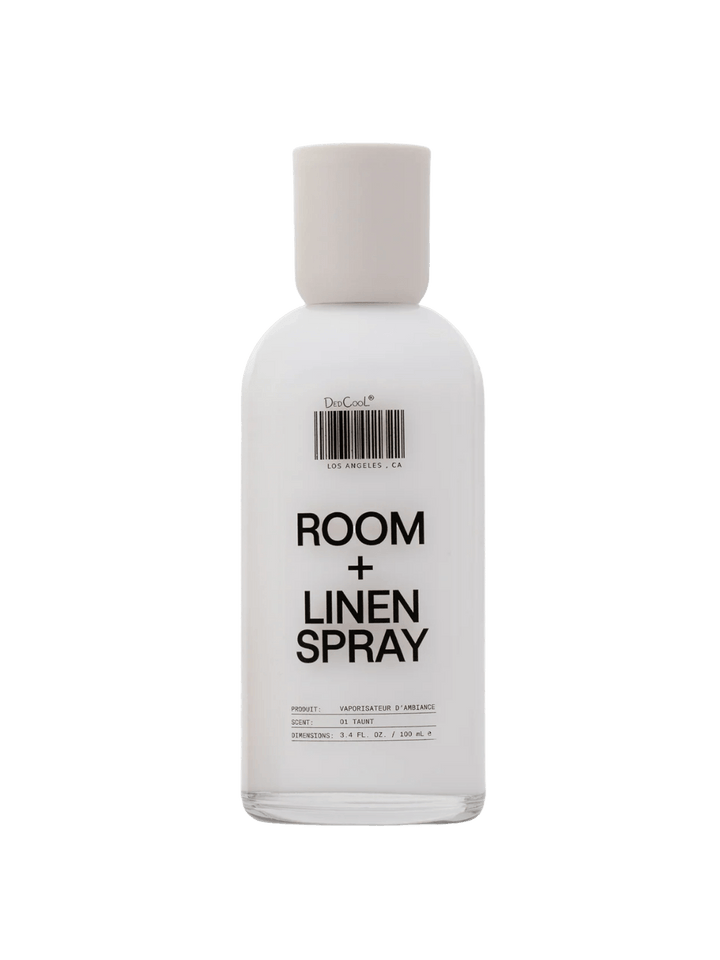 A white opaque Dedcool Room + Linen Spray 01 "Taunt" 100ml glass bottle featuring its signature barcode design and a matching white cap | Twentyseven Toronto