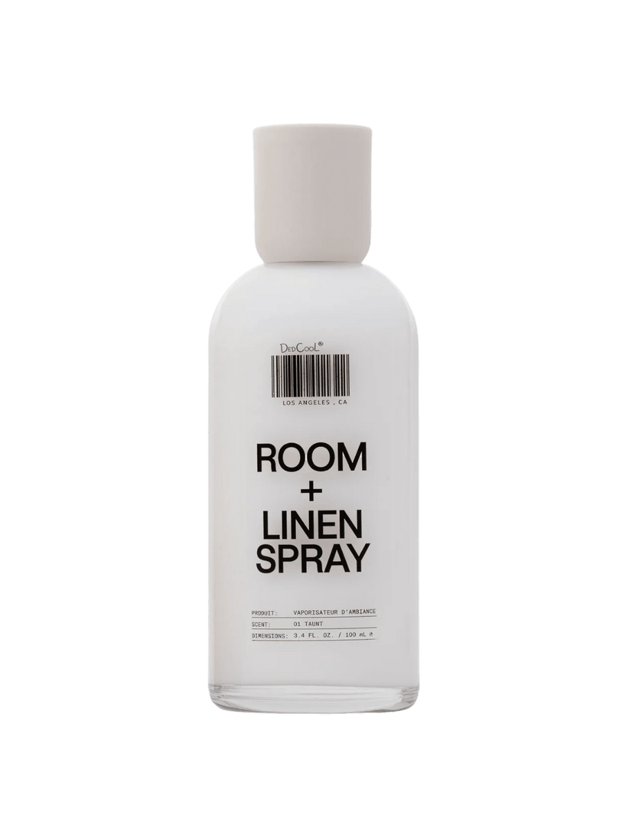A white opaque Dedcool Room + Linen Spray 01 "Taunt" 100ml glass bottle featuring its signature barcode design and a matching white cap | Twentyseven Toronto