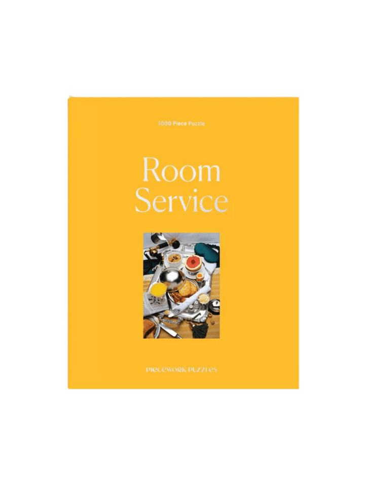 The Piecework Puzzles Room Service 1000 Piece Puzzle showcases its bright yellow box cover | Twentyseven Toronto