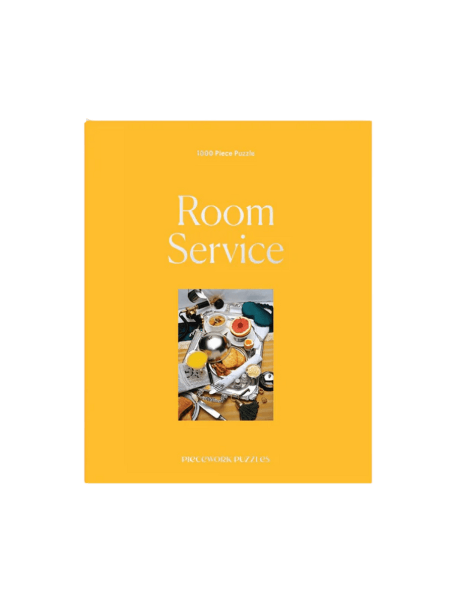 The Piecework Puzzles Room Service 1000 Piece Puzzle showcases its bright yellow box cover | Twentyseven Toronto
