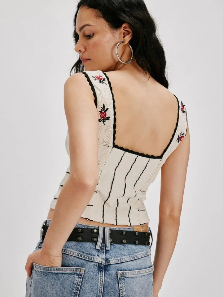 A view from the back highlights the square neckline, dark scalloped trim, and vertical striped patterns of the Free People Rose Bud Knit Top - Ivory Combo | Twentyseven Toronto