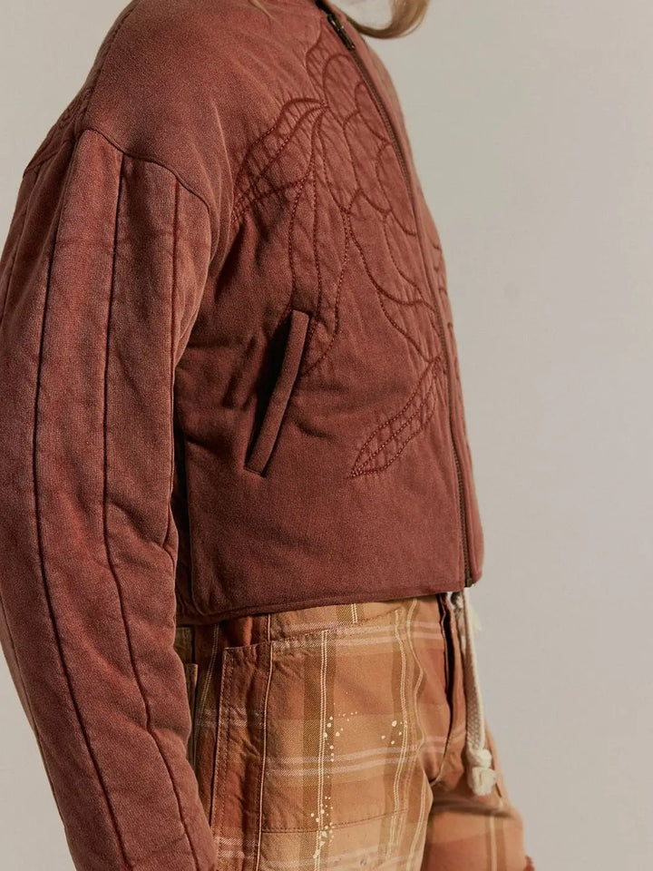 A side angle showcases the structured waist hem and the clean welt opening of the side pocket on the Free People Rose Zip-Up Sweatshirt - Cinnamon Stick | Twentyseven Toronto